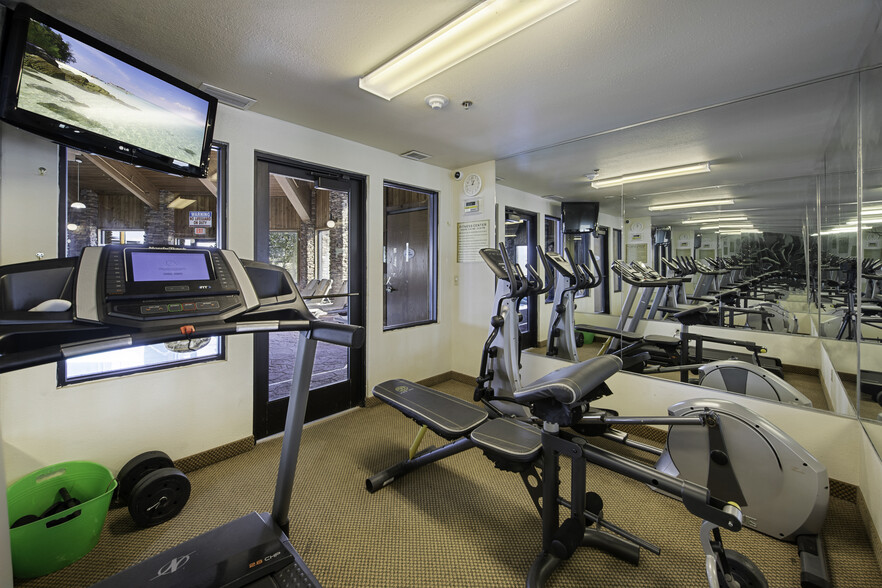 Fitness room with treadmill and weights