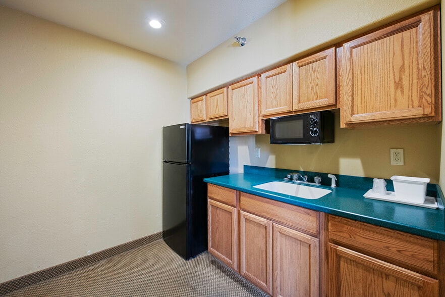 Kitchenette with refrigerator and microwave