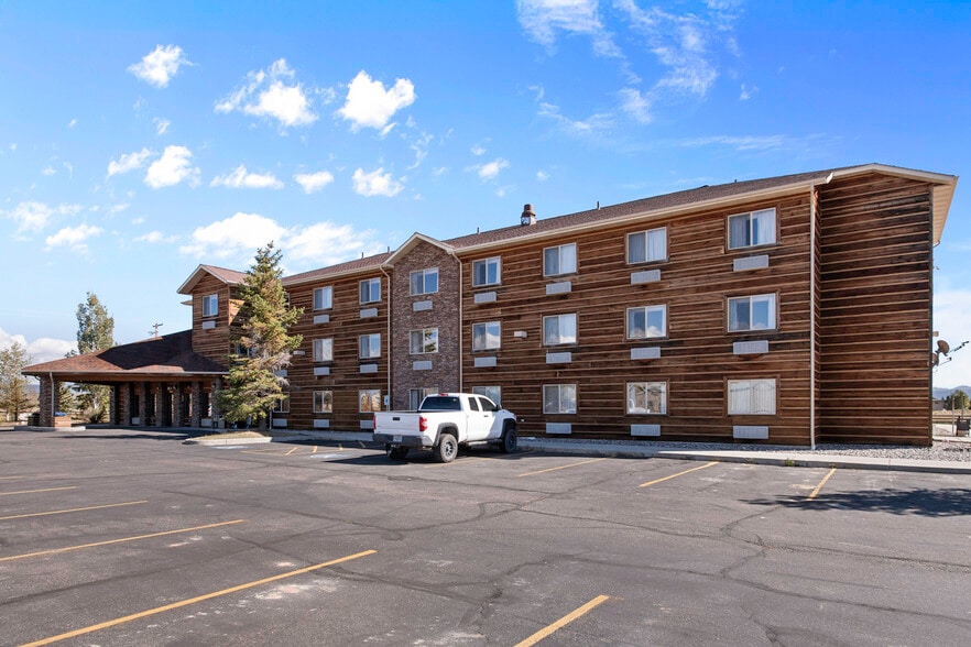 Hotel exterior with mountain backdrop